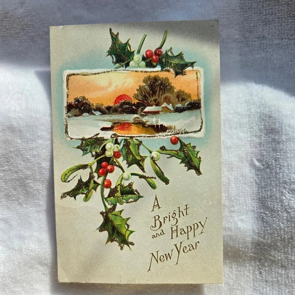 Antique New Year Postcard Holly Mistletoe Winter Sunset Gold Gilt Embossed 1910s